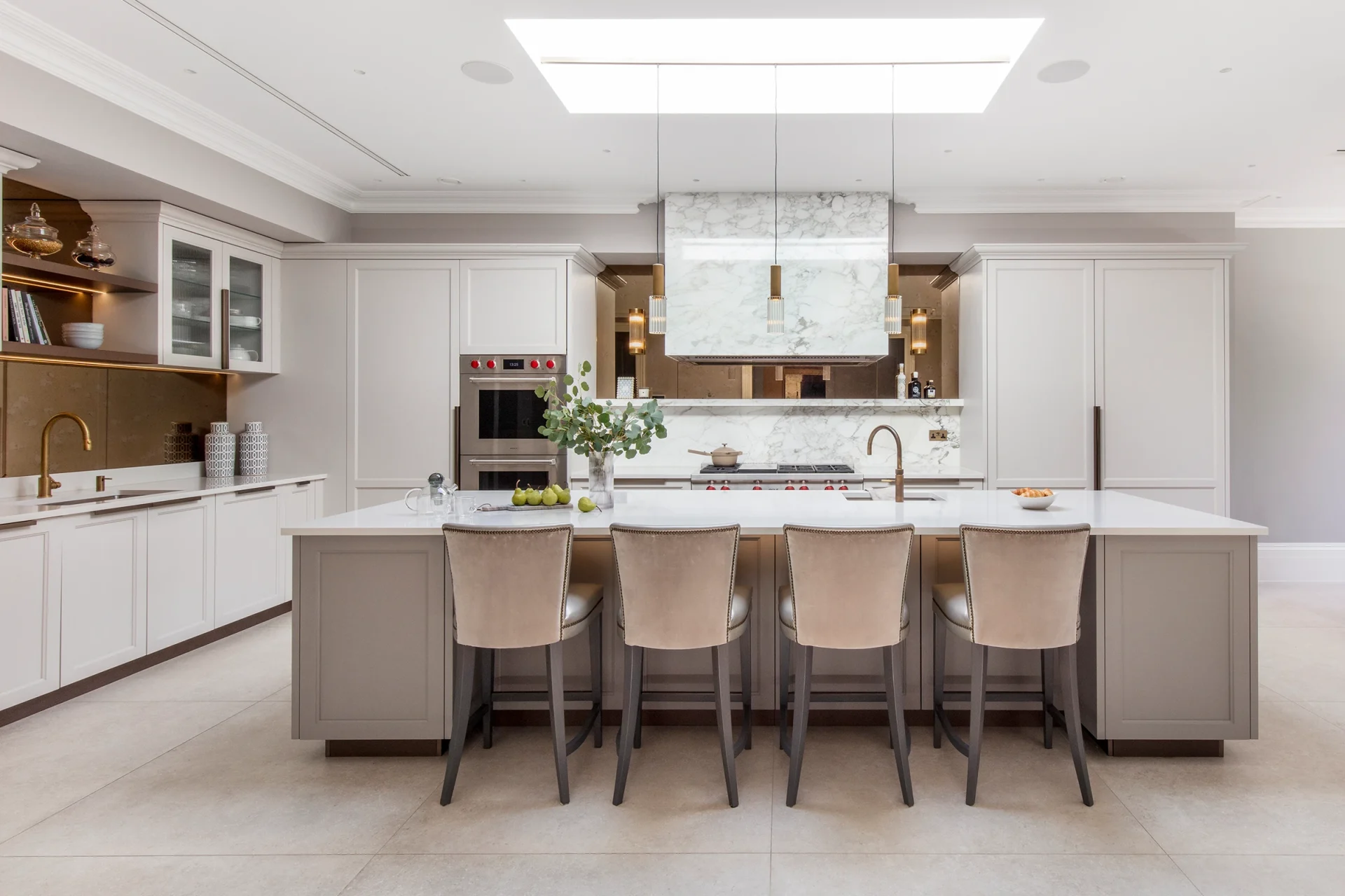 A large statement kitchen island with luxury shaker kitchen cabinetry by Extreme Design.