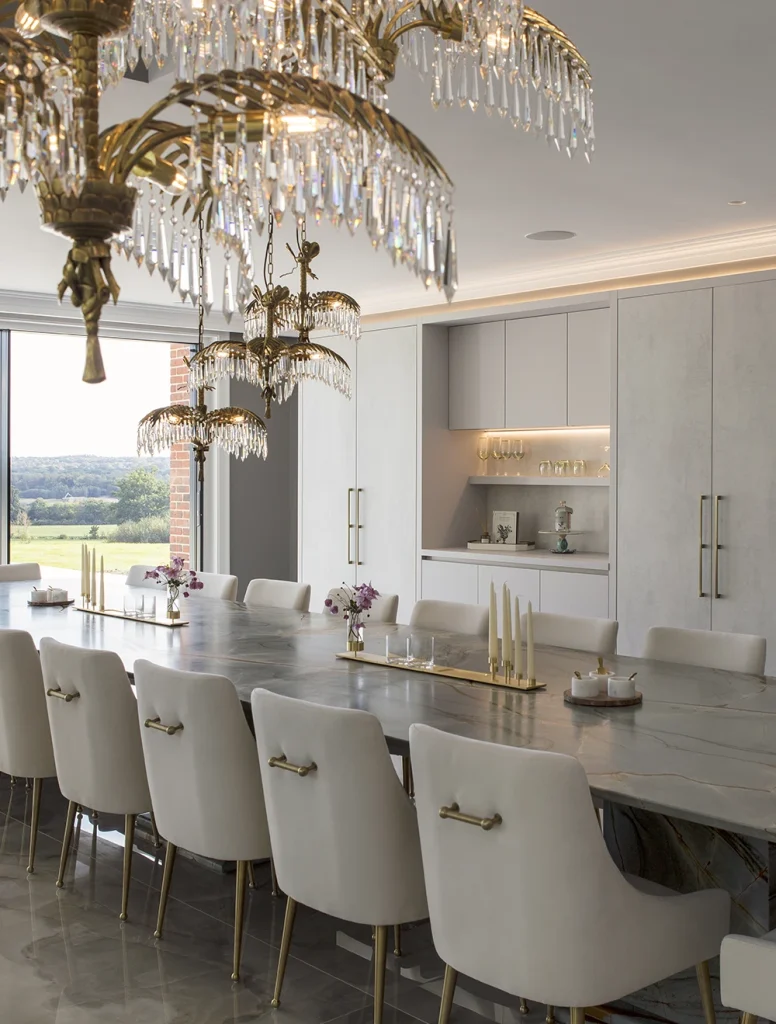 luxurious dining room with bespoke fitted cabinets and large stone dining table