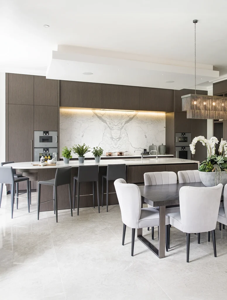 opulent kitchen with high ceilings and island breakfast bar dining