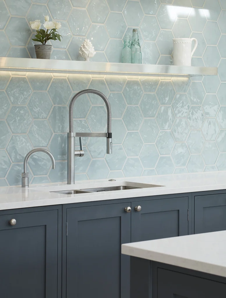 Traditional kitchen with blue handpainted kitchen cabinets and tiled splashback